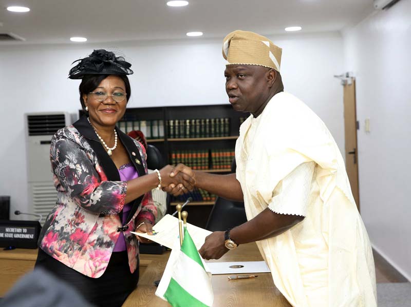 Lagos State Governor, Mr. Akinwunmi Ambode (right), congratulates Mrs. Folasade Adesoye shortly after her swearing-in as the 20th Head of Service at the EXCO Chamber, Lagos House, Ikeja, on Tuesday, November 14, 2017.